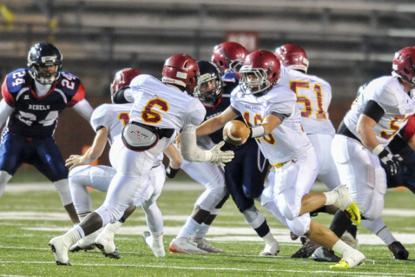 Escambia Academy's Kevin Gumapac (10) hands off the ball to Kris Brown (6) during the AISA Class AAA State Championship Game help Friday, November 21, 2014 at Troy University's Veterans Memorial Stadium. Bessemer leads Escambia at the half, 14-7. (Photo/Joey Meredith)