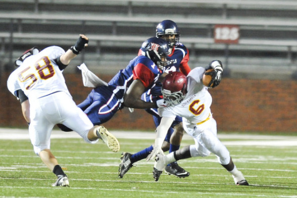 Escambia Academy's Kris Brown (6) is tackled during the AISA Class AAA State Championship Game help Friday, November 21, 2014 at Troy University's Veterans Memorial Stadium. Bessemer leads Escambia at the half, 14-7. (Photo/Joey Meredith)