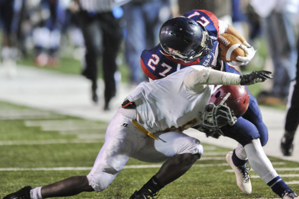Bessemer Academy's Brodie Medders (27) is tackled during the AISA Class AAA State Championship Game held Friday, November 21, 2014 at Troy University's Veterans Memorial Stadium. Escambia Academy came from behind in the fourth quarter to win 35-28. (Photo/Joey Meredith)