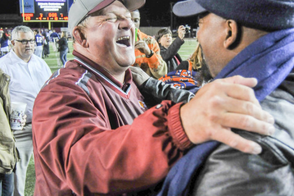 Escambia Academy Head Coach High Fountain celebrates with fans after his team won the AISA Class AAA State Championship Friday, November 21, 2014 at Troy University's Veterans Memorial Stadium. Escambia Academy came from behind in the fourth quarter to win 35-28. (Photo/Joey Meredith)