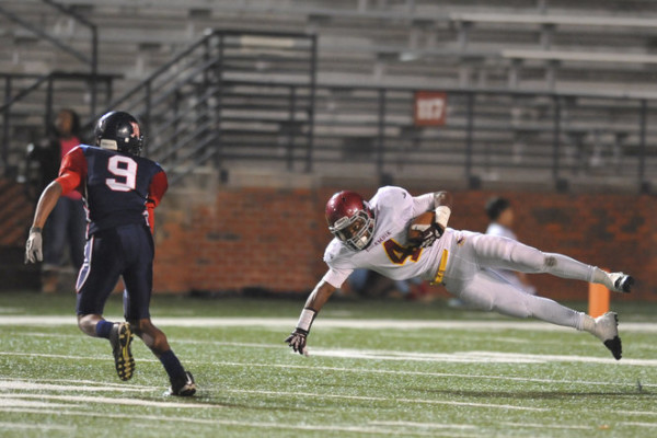 Escambia Academy's Tim Finklea (4) dives for extra yards during the AISA Class AAA State Championship Game held Friday, November 21, 2014 at Troy University's Veterans Memorial Stadium. Escambia Academy came from behind in the fourth quarter to win 35-28. (Photo/Joey Meredith)